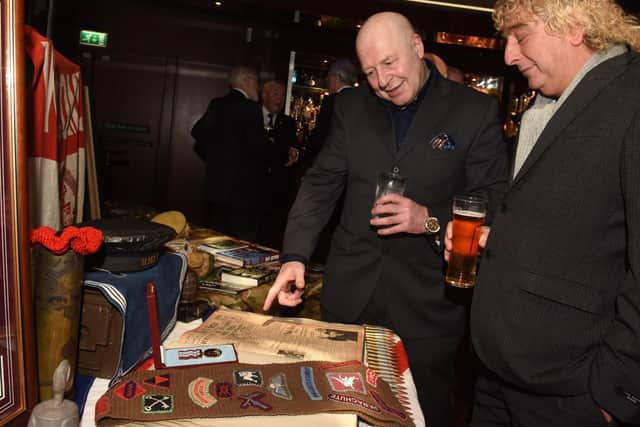 Nick Clayton and Ian Fidler look at memorabilia on display