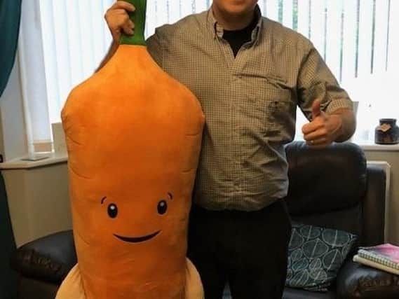 Paul Nowak with the giant Kevin the Carrot cuddly toy he is raffling off in aid of Katie