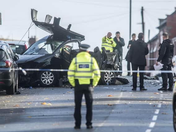 Police officers are often forced to close roads following collisions