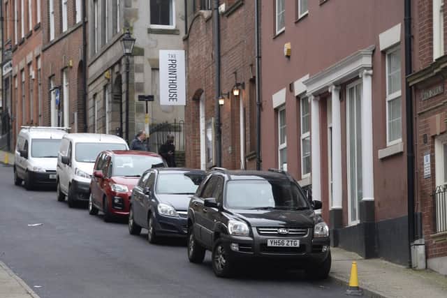 Cars parked on North Chuirch Street where the council have resurfaced but not painted the road.