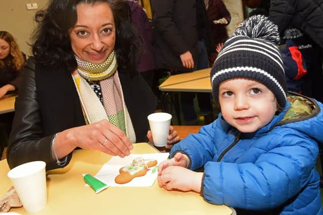 Selina and Archie Sawhney decorate a biscuit at the Whirlow Hall Farm Christmas Fayre