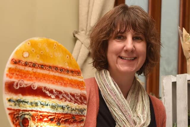 Jayne Hides, of the Little Glass Room with her glass ornaments at the Tapton Hall Craft Fayre