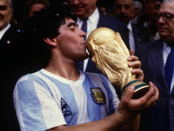 Diego Maradona lifts the World Cup in 1986.