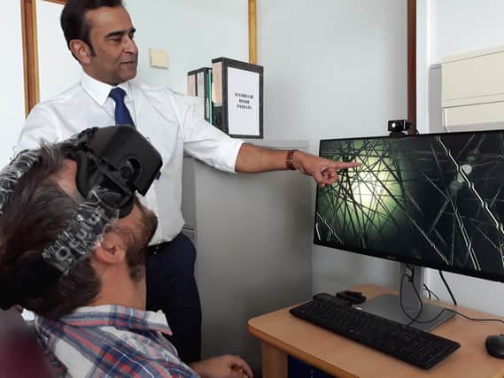 Sheffield Teaching Hospitals NHS Foundation Trust has become the first NHS Trust in the country touse virtual reality gaming to treat visual vertigo in everyday NHS practice. Professor Jaydip Ray is pictured with a patient using the virtual reality technology