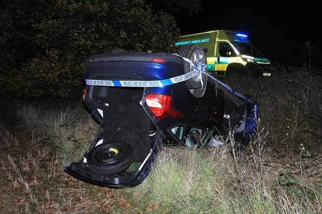 The car landed on its roof in a field this morning (Picture: Sean Stewart)