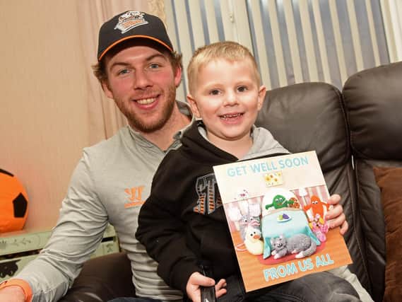 William Fewkes, with Sheffield Steelers player Ben O'Connor, after William was rushed to hospital with meningococcal septicaemia and the Sheffield Steelers sent a get well card to him.