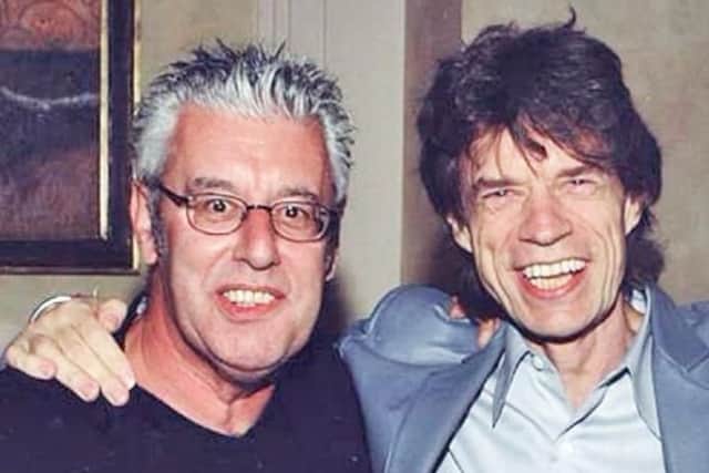 Ray Cooper with Mick Jagger.