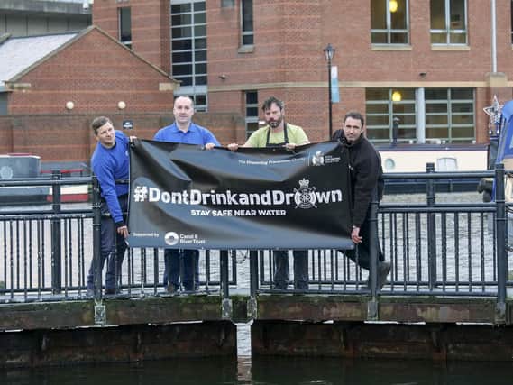 The Canal and River Trust's Tom Wright, Kevin Young and Anthony Walker with local bar owner Richard Henderson launch the #DontDrinkandDrown Campaign at Victoria Quays