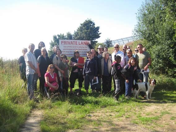 Wincobank residents hold protest walk against plans to build houses on open space which they believe was once part of the old Roman Ridge.
Pictured at the development site on Sandstone Road.