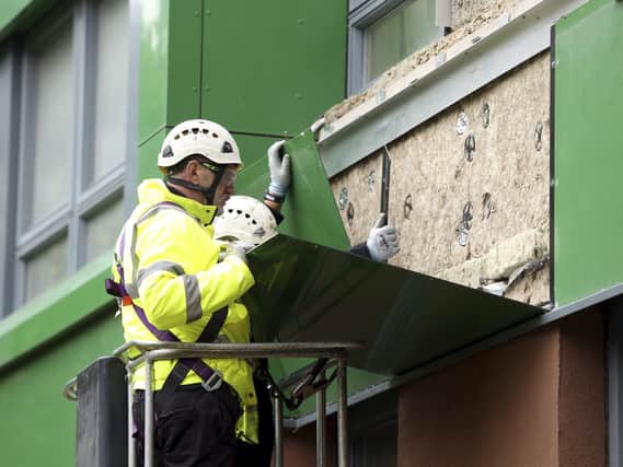 Part of the cladding at Hanover Way tower block is being removed and replaced