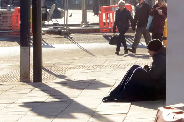 A beggar on the streets of Sheffield city centre.