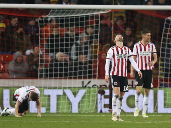 Sheffield United players show their disappointment after conceding against West Brom