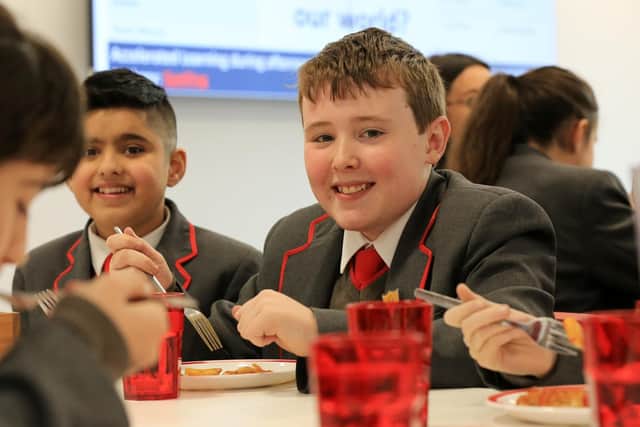 Reuben Steele, 11 enjoys his meal during the family lunch