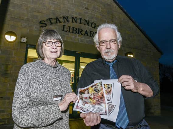 Mel Smart and Bob Mynors ar Stannington Library where posters are being ripped down.