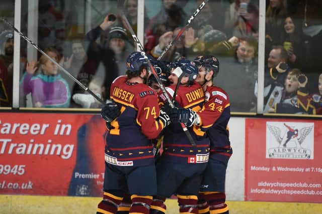 Guildford congratulate themselves after a goal