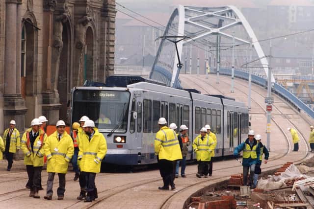 Supertram makes its first entry into the city centre arriving on a proving journey over the new bow string bridge into Commercial Street, 5th November 1993