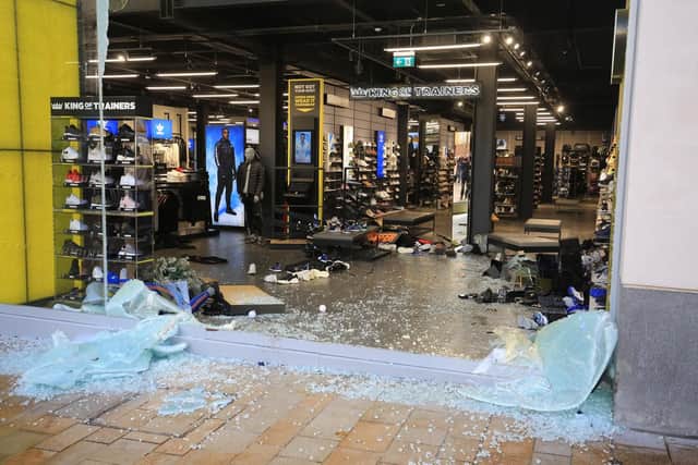 Smashed windows at JD Sports on The Moor.