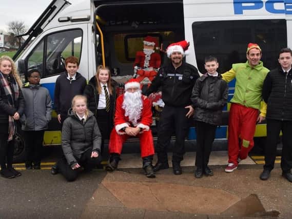 Staff and pupils at Swinton Academy with members of the Rawmarsh local policing team