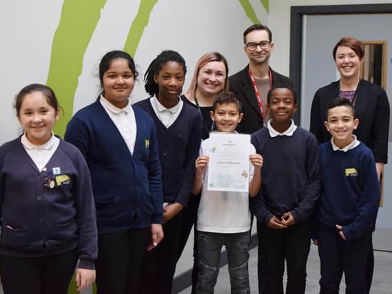 Pupils from Oasis Fir Vale Academy with principal, Helen Round, Agnieszka Freeman, parent partnership lead, and Sheffield City of Sanctuary co-chair, Craig Barnett.