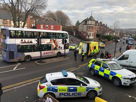 The scene on Burngreave Road after a pedestrian was hit by a bus.