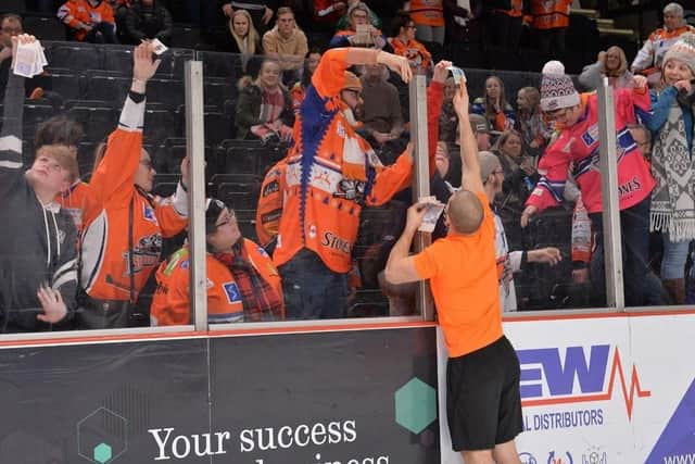 Fans passed money over the glass when former Steelers favourite Ryan Finnerty said he'd have his head shaved if they could raise 500. Picture: Dean Woolley.