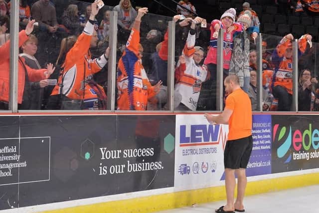 Fans passed money over the glass when former Steelers favourite Ryan Finnerty said he'd have his head shaved if they could raise 500. Picture: Dean Woolley.