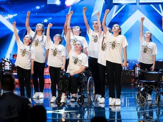 Hollie Booth - seated in the wheelchair - and RISE. Picture: ITV