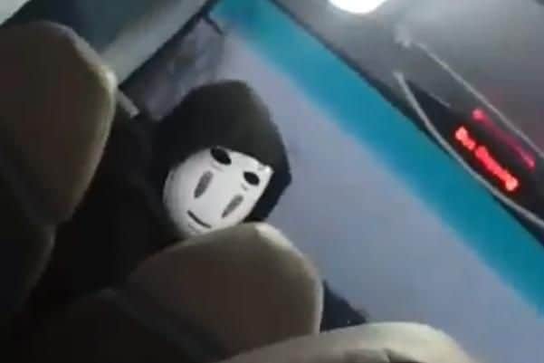 Masked man on bus