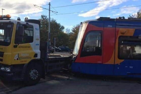 The aftermath of a collision involving a lorry and a tram-train at the junction of Staniforth Road and Woodbourn Road in Sheffield
