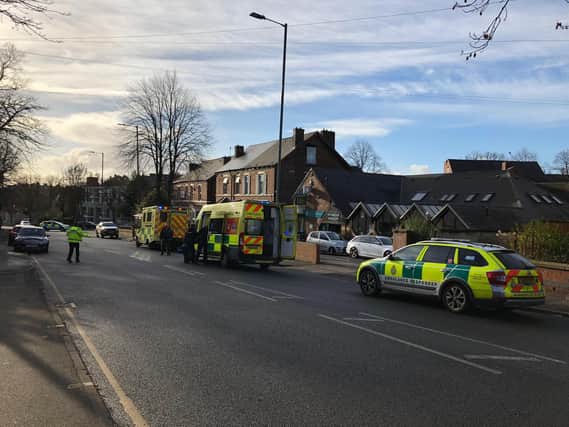 A woman was taken to hospital after a collision with an ambulance in Sheffield