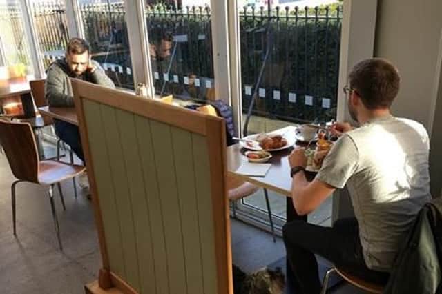 The couple were made to sit behind a screen at the Walled Garden Coffee Shop and Restaurant