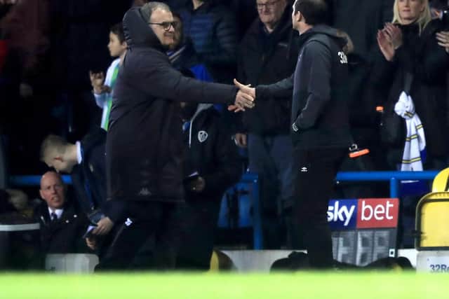 Derby County manager Frank Lampard (right) and Leeds United manager Marcelo Bielsa shake hands prior to the beginning of the Sky Bet Championship match at Elland Road, Leeds. Simon Cooper/PA Wire.