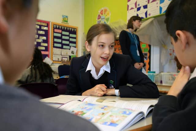 Primary school pupils from Arbourthorne Primary School are being taught Latin to help improve literacy standards. The initiative is being supported by Classics teachers from Sheffield High School for Girls. Pictured in one of the lessons is Imogen Graus, 13, from Sheffield High School for Girls. Picture: Chris Etchells