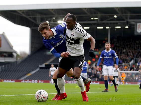 Oldham Athletic's Callum Lang (left) and Fulham's Neeskens Kebano battle for the ball during the Emirates FA Cup, third round match at Craven Cottage, London.  John Walton/PA Wire.