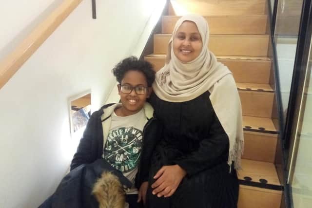 Rashid Elmi, 12, vice-president of the Aspirers Society, with his mum Zahra Abdullahi