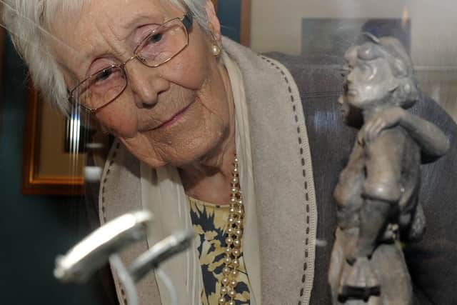 Kathleen Roberts looks at the Women of Steel maquette at the Weston Park Museum.