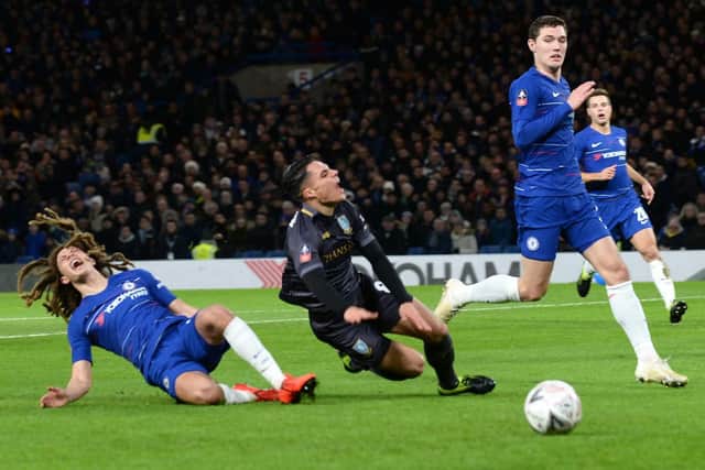Chelsea'ss Ethan Ampadu tackles Owls Joey Pelupessy in the box but the penalty is overturned by VAR