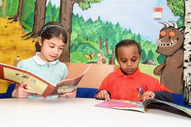 Maya and Aisha of Hunter's Bar Infant School read a book each to gain inspiration for the 500 words competition, which the school are launching on the Radio 2 breakfast show with Zoe Ball.