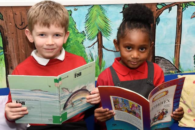 Danny and Anayah of Hunter's Bar Infant School reading their books to gain inspiration for the 500 words competition, which the school will be launching on the Radio 2 breakfast show with Zoe Ball.