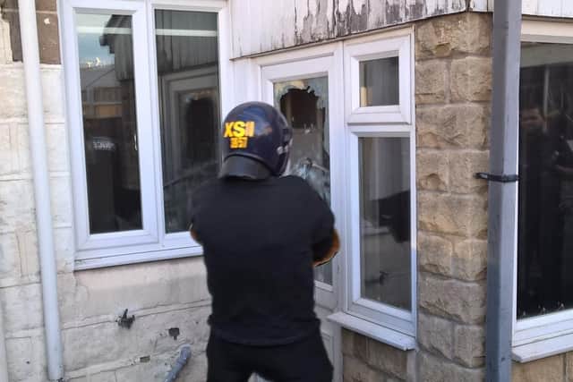 Officers from Manor and Arbourthorne neighbourhood police team on a raid last year.