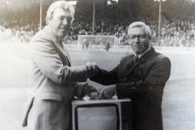 Roy Ashton is presented with a television from Fred Walters after he won 2nd prize in the weekly draw.  Picture: NSST-28-01-19-Ashton-5