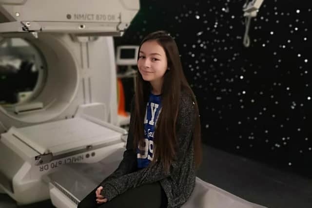 14-year-old Gemma Dias with Sheffield Children's Hospital's new SPECT CT scanner.