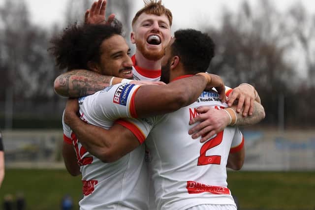 Sheffield Eagles' players celebrate a try for Joel Farrell against Swinton Lions.