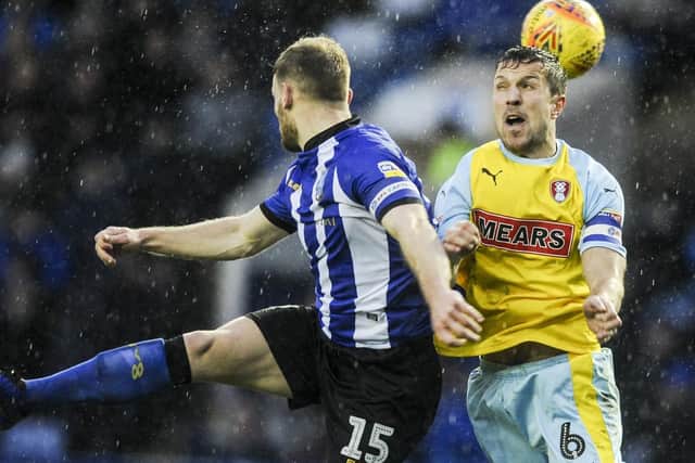 Sheffield Wednesday's Tom Lees and Rotherham United's Richard Wood contest the ball in the air