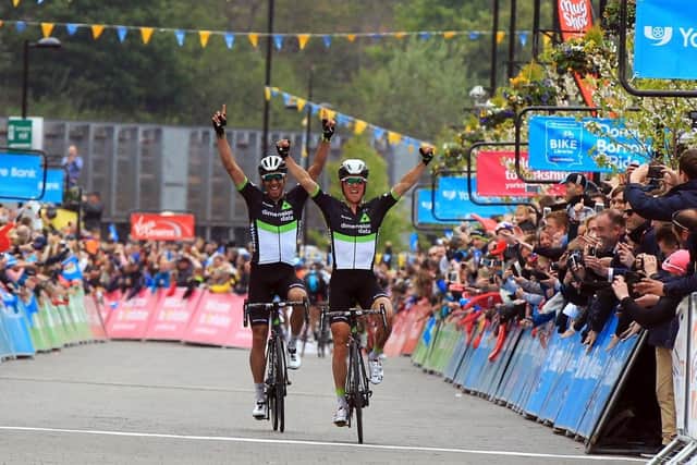 Riders cross the finish line at the Tour de Yorkshire in Fox Valley