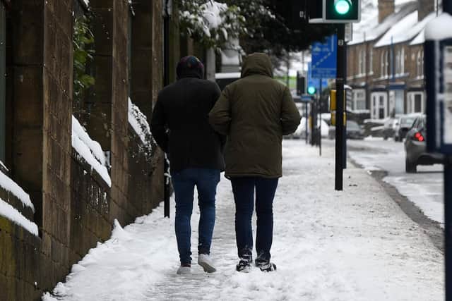 People walking in the snow on City Road in 2018