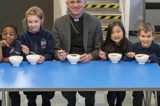 The bishop enjoys lunch with (L-R) Tamede Karin-Mohammed, Ruby Shepherd, Fern So and Alex Mearns. Picture Scott Merrylees