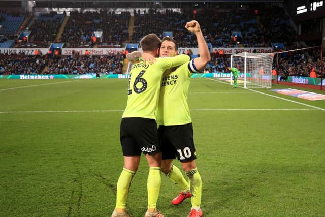 Sheffield United's Billy Sharp (right) celebrates scoring his side's third goal of the game during the Sky Bet Championship match at Villa Park, Birmingham. Nick Potts/PA Wire.