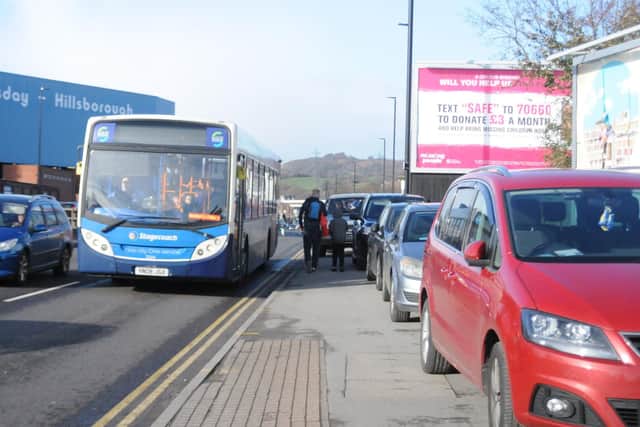 Pedestrians struggle to walk due cars parked on the pavement on Penistone Road. Picture: Sam Cooper / The Star