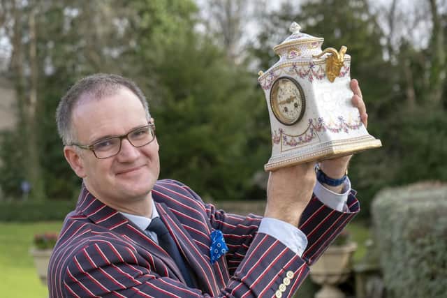 Antiques expert Charles Hanson with a Sevres Porcelain Mantel Clock c1900 at a charity event at Kenwood Hall. Picture Scott Merrylees